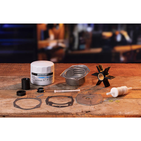 Quicksilver 8M0170717 service kit components on a workbench